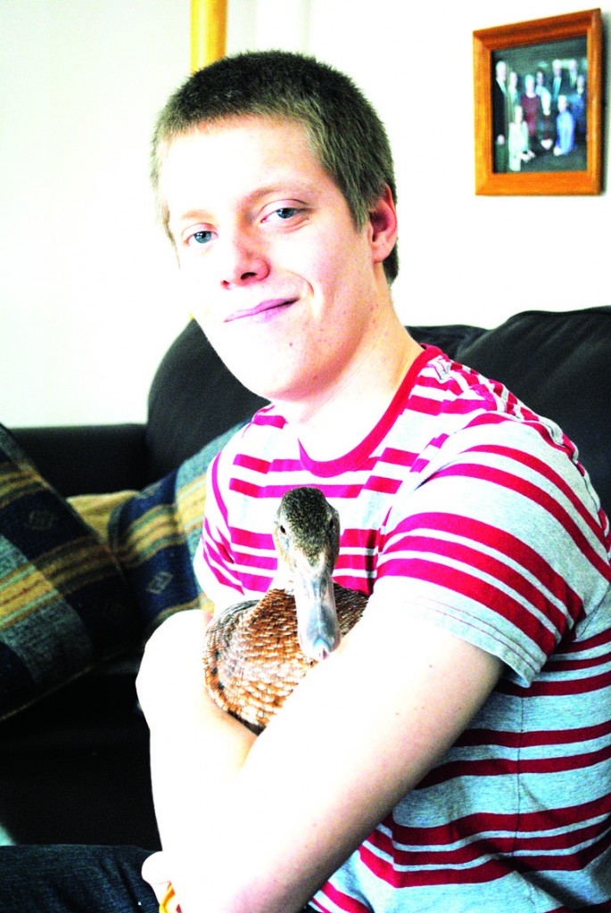 PHOTO BY JESSICA MARTIN Alex Fisher was never planning on owning a duck, but when his friend handed him a little ball of fluff nine months ago, he couldn’t say no. Ferdy turned out to be really docile and friendly and his parents had no objection.