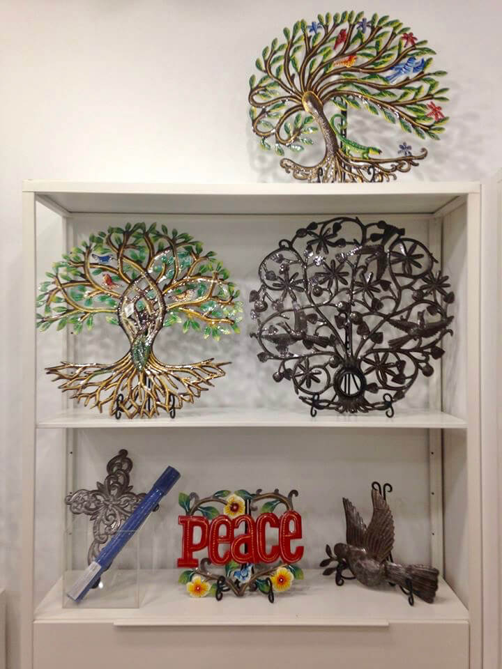 Pieces displayed at Ten Thousand Villages Waterloo in Feb. 2020, including tree designs made from oil drums by workers associated with Comité Artisanal Haïtien in Haiti