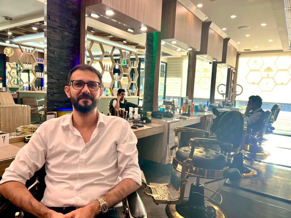 Mohamad Al Ahmad sitting in City Style Salon and Barbershop