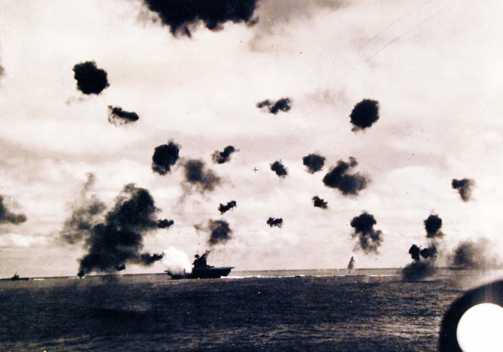 USS Yorktown is torpedoed at Midway amid bursts of flak