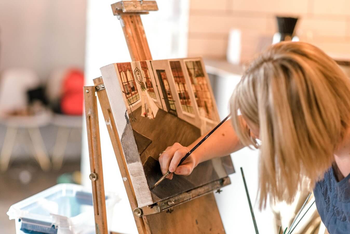 Artist Emily McDougall paints.