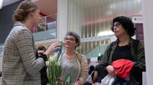 Personal support worker student JJ Bowman, centre, listens to a representative from Lutherwood Village retirement home at a career fair