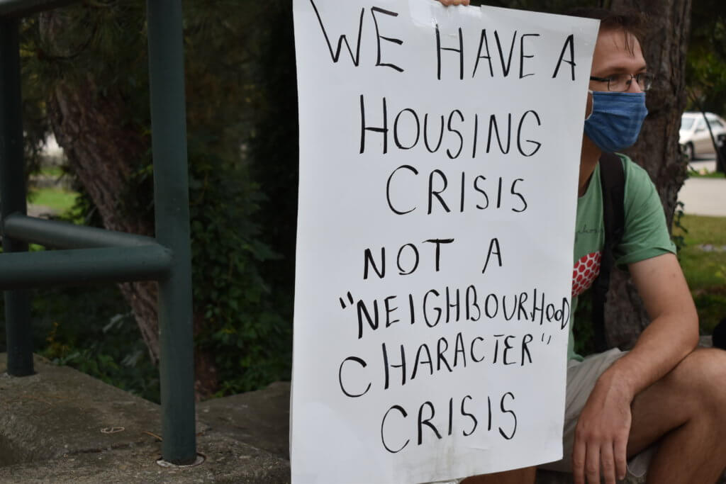 Man holding poster