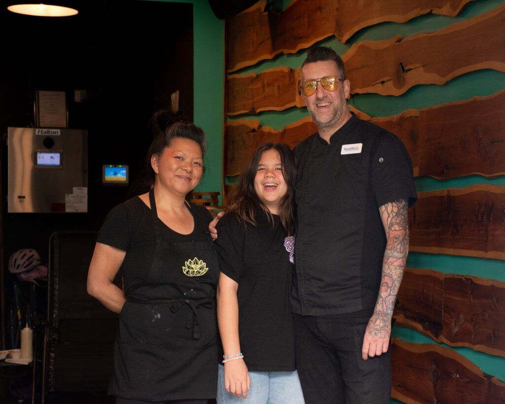 Nguyen and Wood with their daughter, Lotus, in the middle. Photo by John Dalusong